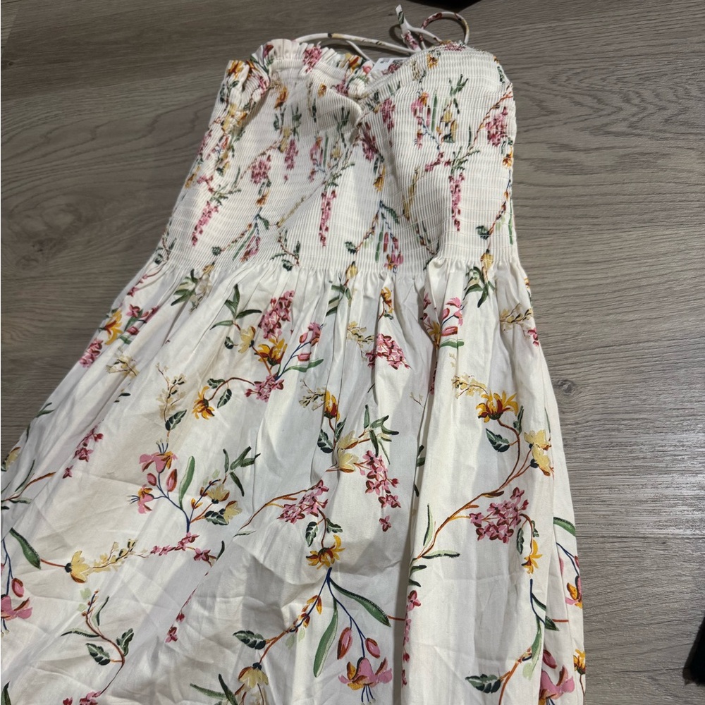 H&M blue and white floral pattern dress with adjustable straps.